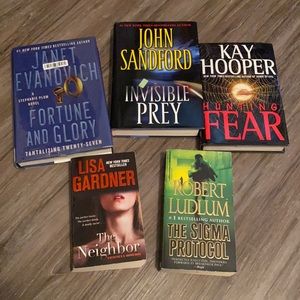 3 hardback and 2 soft cover books.